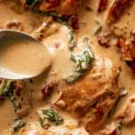 Creamy Tuscan Chicken Thighs drizzle with the best cream sauce!