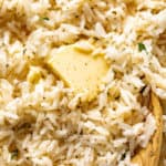 Garlic Butter Rice served with melted butter and cracked black pepper | craveitall.com